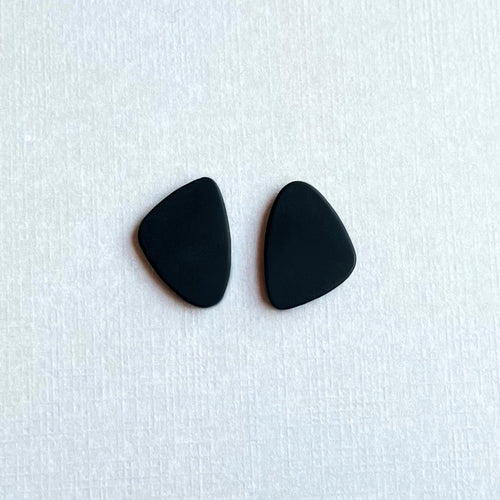 Matte black organic shaped statement stud earrings handmade from polymer clay by Vertseas