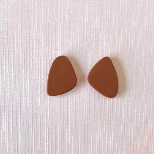 Brown organic shaped statement stud earrings handmade from polymer clay by Vertseas