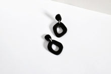 Load image into Gallery viewer, Matte black organic shape hoop earrings handmade from polymer clay.
