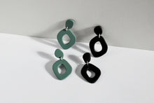 Load image into Gallery viewer, Sage Green and matte black organic shape statement hoop earrings handmade from polymer clay.
