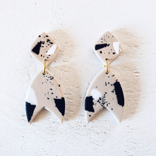 Ray statement earrings hand cut and handmade from polymer clay black sand